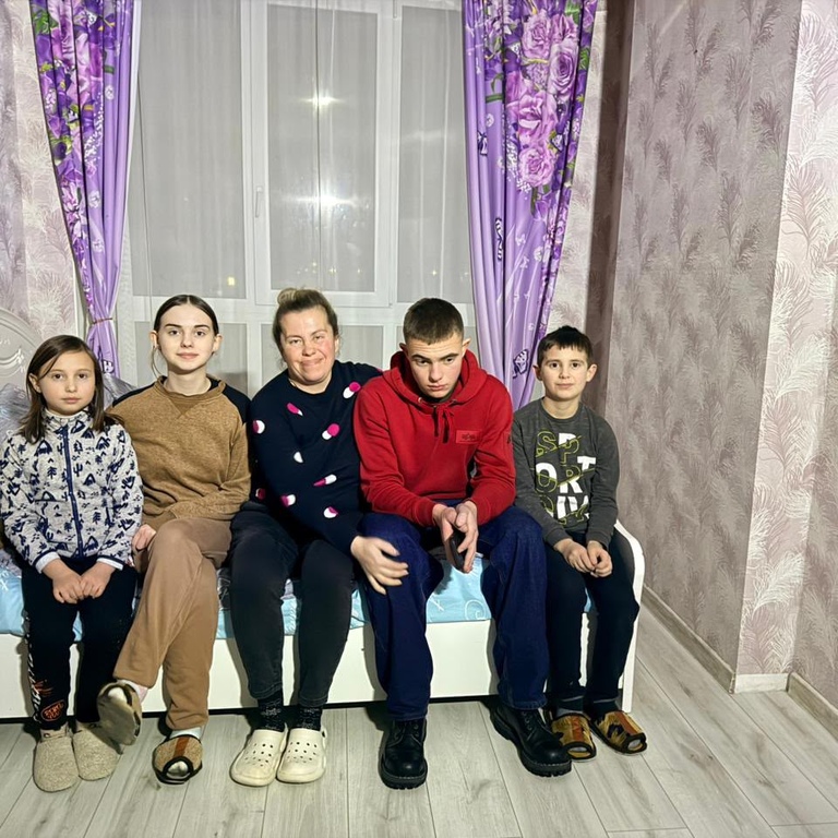Lilia Podkopayeva with children supported by Health of Generations.